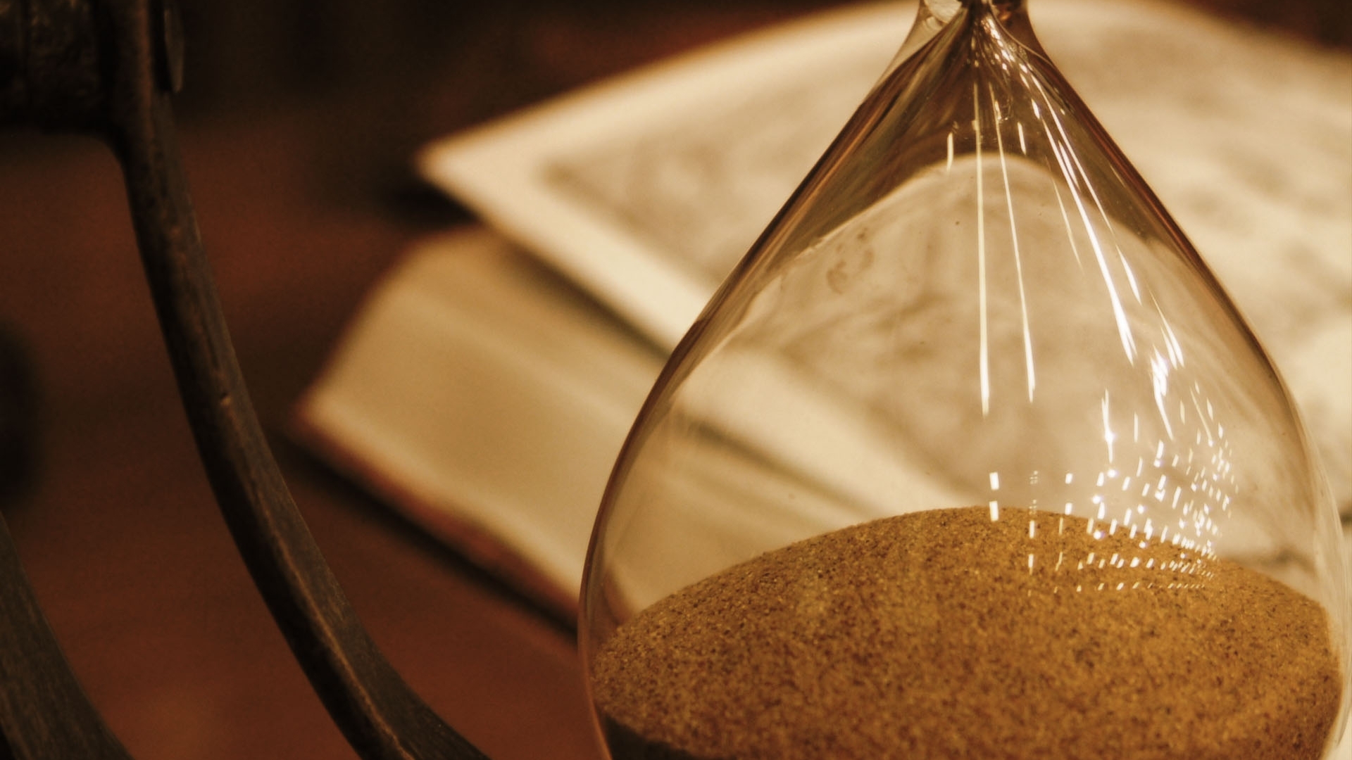 hourglass and book